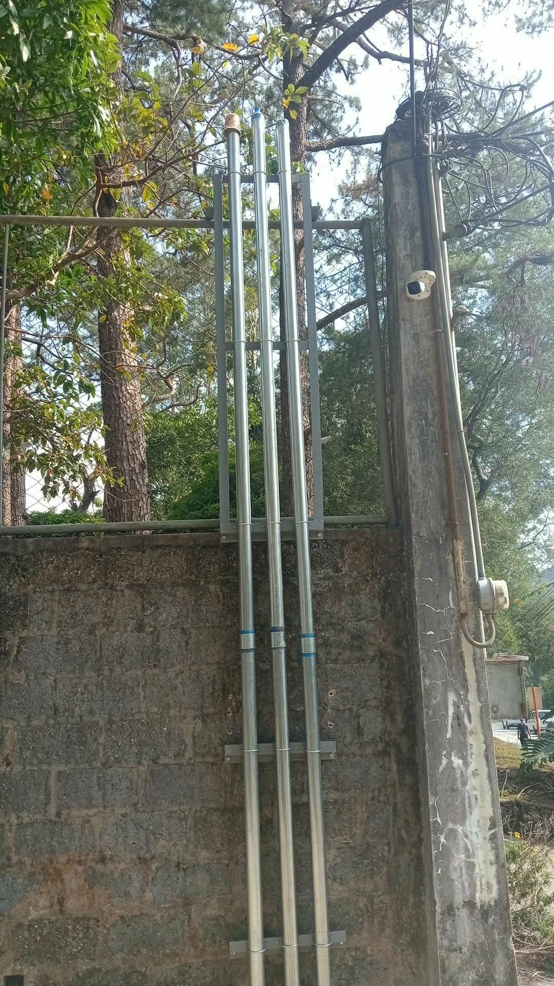 Electrical riser conduits on a building exterior